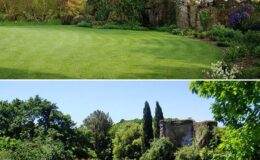 Lush green garden landscape featuring manicured grass and vibrant flower beds, accompanied by a scenic view of trees and historic ruins in a sunny setting.