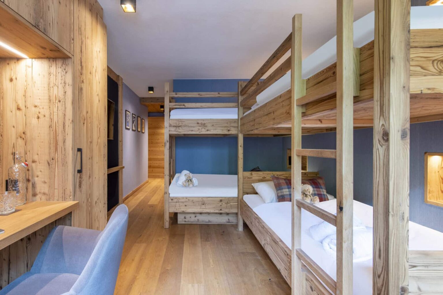 Cozy interior of a modern bunk bed room featuring wooden furniture, a spacious layout, and natural light, ideal for family or group stays. | Only on SopranoVillas
