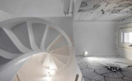 Modern interior design featuring a spiral staircase and artistic ceiling and floor patterns in a bright, minimalist space.