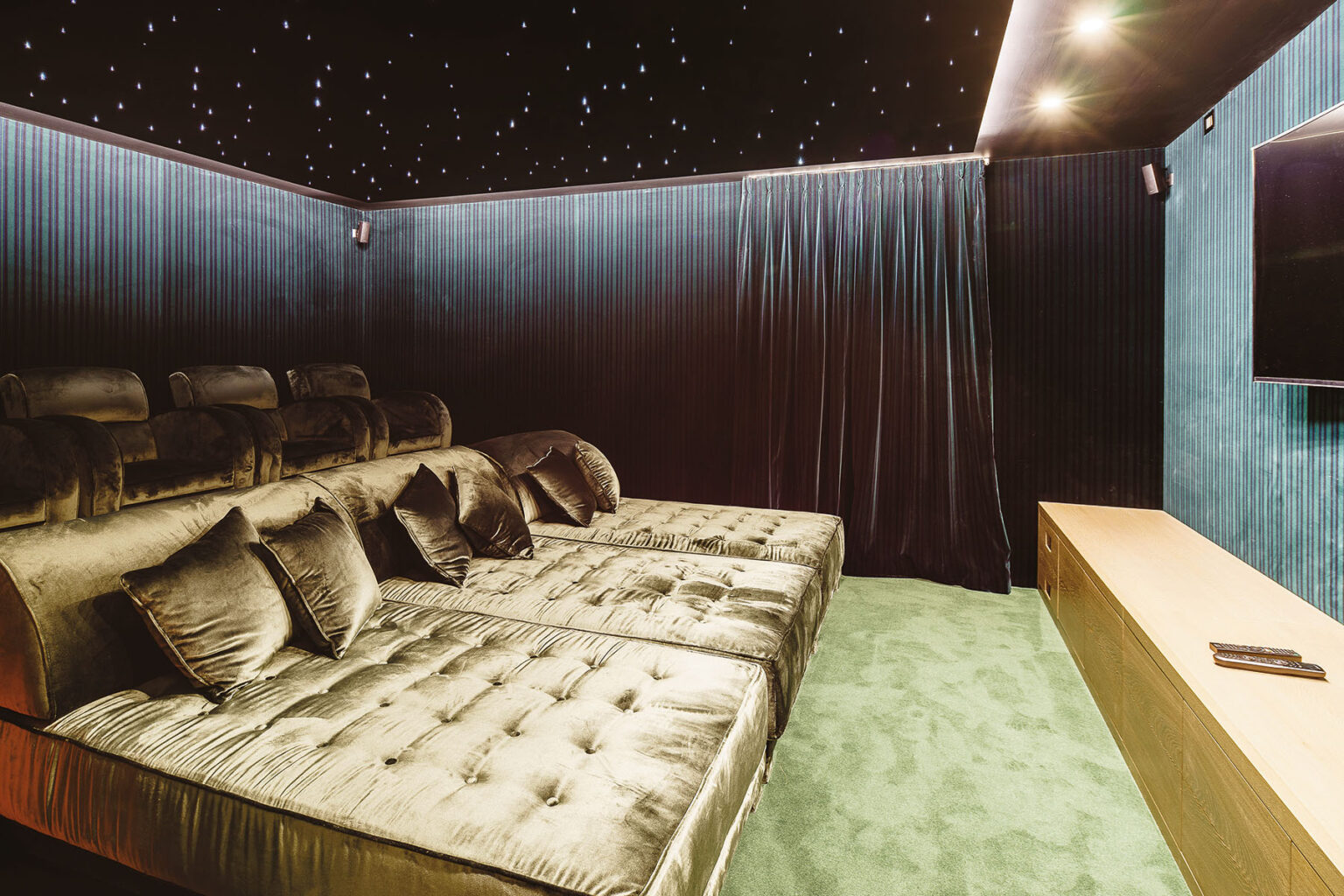 Luxurious home theater featuring plush velvet seating, a starry ceiling, and modern entertainment setup, ideal for movie nights and relaxation. | Only on SopranoVillas