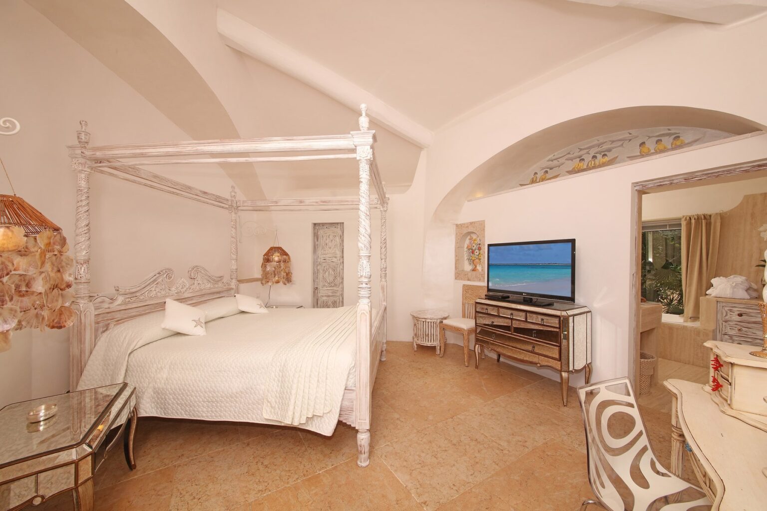 Spacious and elegantly designed bedroom featuring a four-poster bed, modern television, and stylish furnishings, with arched ceilings and soft lighting, ideal for a luxurious getaway. | Only on SopranoVillas