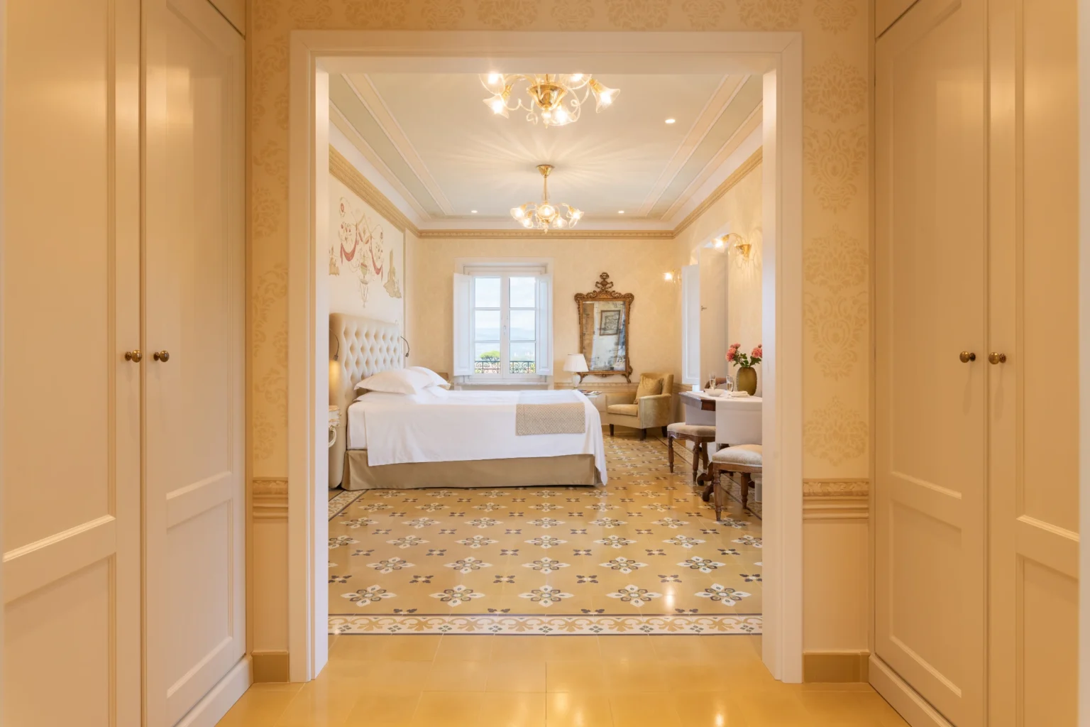 Luxury villa bedroom in Italy featuring elegant decor, a spacious layout, and natural light, perfect for a relaxing getaway. | Only on SopranoVillas