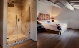 Modern bathroom and bedroom interior featuring a glass shower enclosure with a stone wall, hardwood floors, and a cozy bed with decorative pillows and lamps. Ideal for showcasing stylish home design and relaxation spaces.