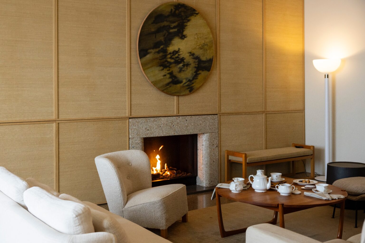 Luxurious interior of a villa in Italy featuring a cozy living room with a fireplace, modern furniture, and elegant decor, perfect for a relaxing getaway. | Only on SopranoVillas