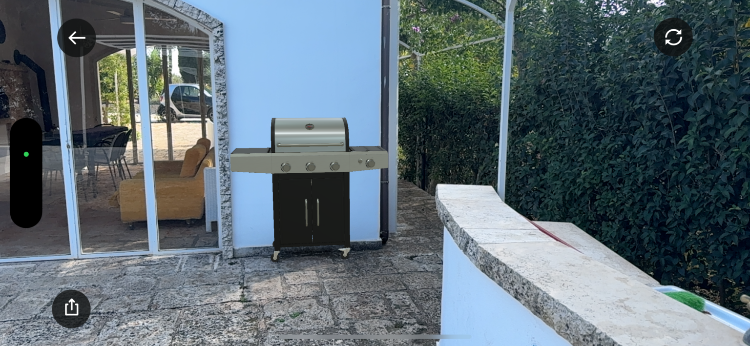 Outdoor patio featuring a modern gas grill next to a stone countertop, surrounded by greenery and a glass-enclosed area with seating. Ideal for outdoor cooking and entertaining. | Only on SopranoVillas