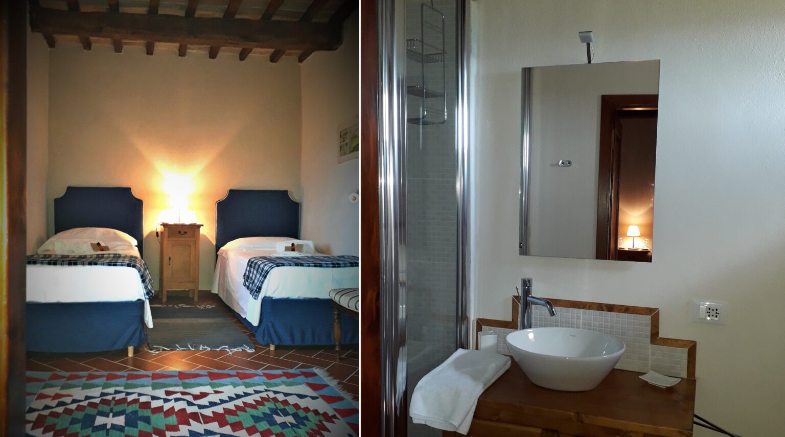 Cozy bedroom with two twin beds and a warm bedside lamp, featuring a colorful patterned rug, adjacent to a modern bathroom with a sleek shower, mirror, and stylish sink. Ideal for a comfortable stay. | Only on SopranoVillas