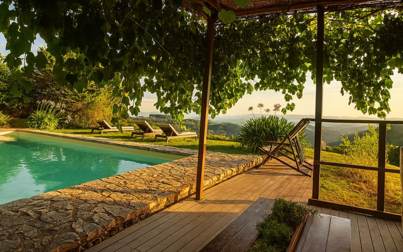 Luxury villa with a private pool surrounded by lush greenery in Italy, featuring a wooden deck and stunning countryside views, perfect for a serene getaway. | Only on SopranoVillas