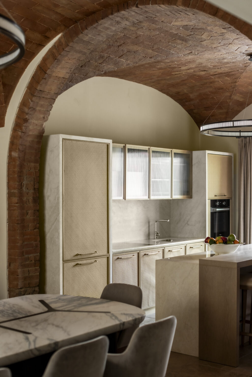 Modern kitchen design featuring elegant cabinetry, a stainless steel sink, and a minimalist aesthetic with natural light filtering through the windows. The space combines functionality with stylish details, ideal for contemporary living. | Only on SopranoVillas