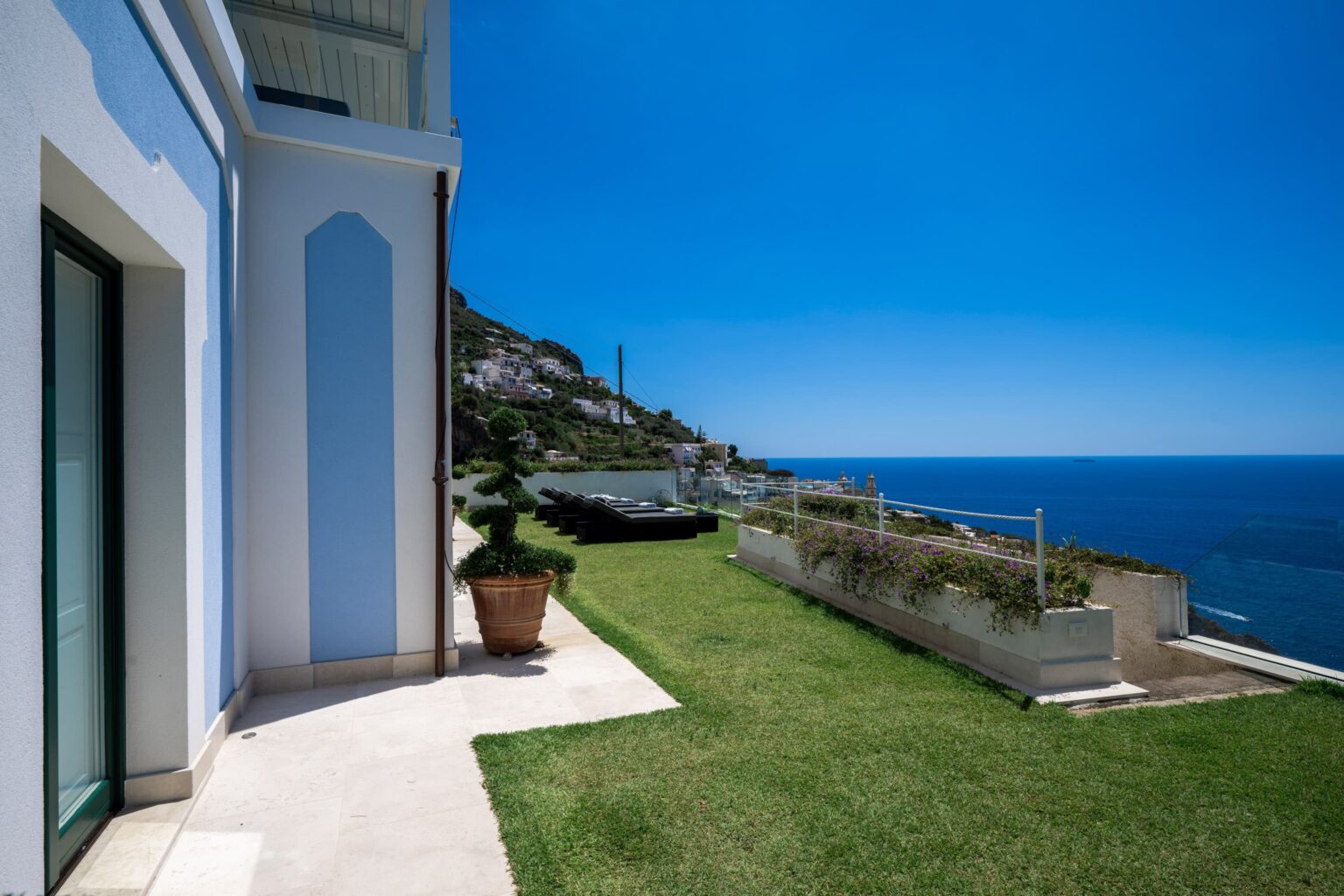 Luxury villa with stunning sea view and landscaped garden in Italy, perfect for vacation rentals. | Only on SopranoVillas