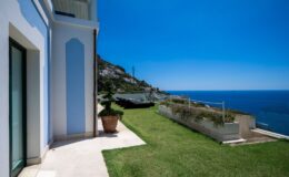 Luxury villa with stunning sea view and landscaped garden in Italy, perfect for vacation rentals.