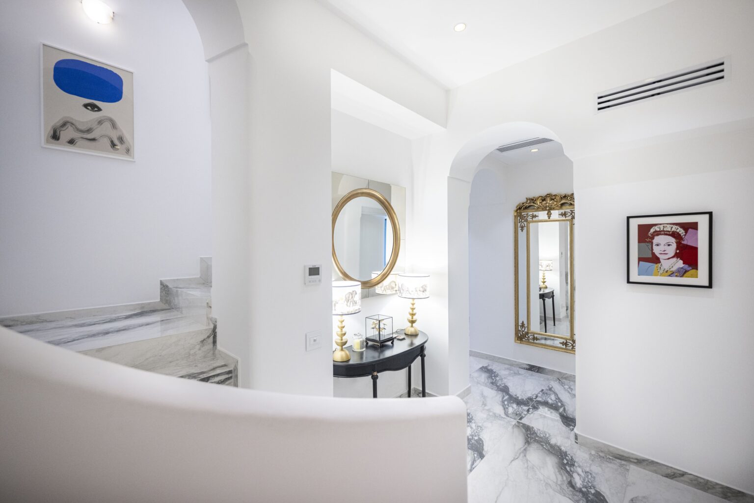 Elegant interior of a luxury villa in Italy featuring marble floors, stylish decor, and ample natural light, ideal for vacation rentals. | Only on SopranoVillas