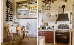 Cozy kitchen and dining area featuring a rustic wooden table with two vintage chairs, a wine rack displaying various bottles, and a well-organized cabinet showcasing glassware. The adjacent kitchen boasts a modern stove, decorative backsplash, and a stylish pendant light, creating a warm and inviting atmosphere.