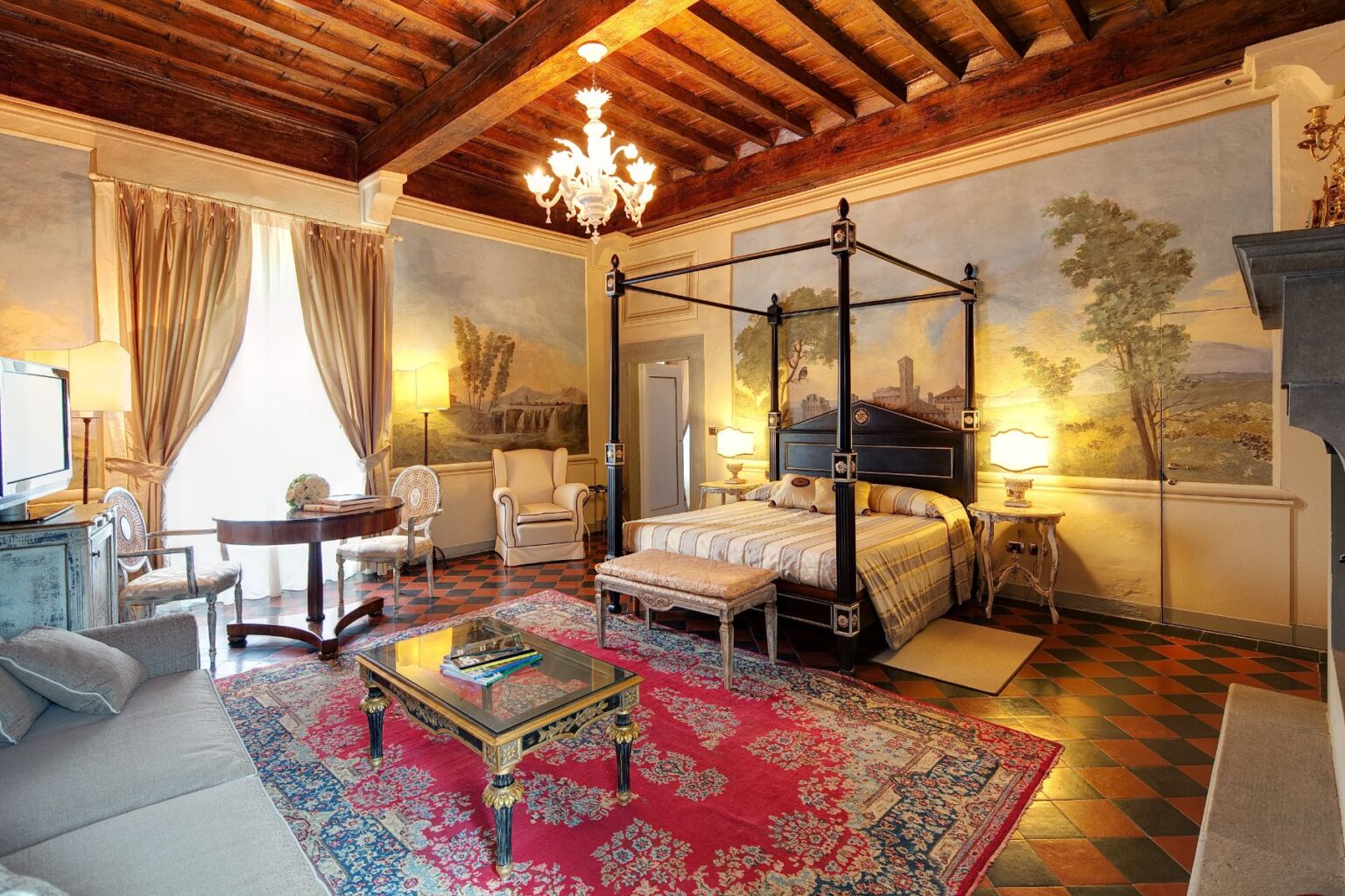 Luxurious hotel room featuring a four-poster bed, elegant furnishings, and vintage decor. The space showcases artistic wall murals, a cozy seating area, and a decorative rug, creating a warm and inviting atmosphere. Ideal for travelers seeking comfort and style. | Only on SopranoVillas