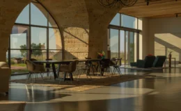 Modern interior design featuring a spacious living area with large windows, natural light, and stylish furniture, highlighting a blend of comfort and elegance in an open layout.