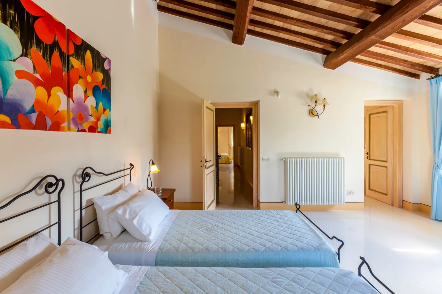Bisenzio_Elegant_Farmhouse_Twin_Bedroom_Exposed_Wooden_Beams.webp | Only on SopranoVillas