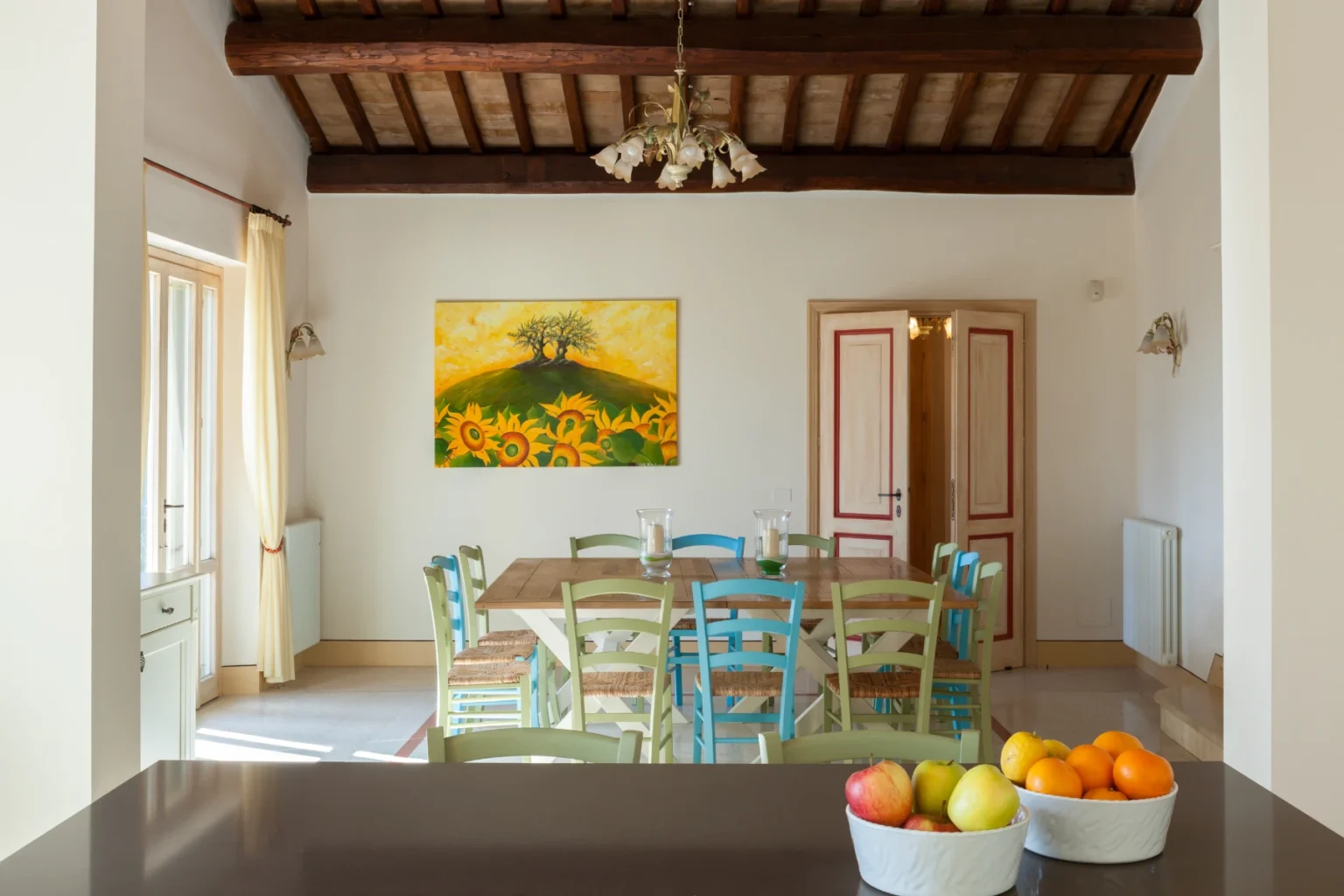 Bisenzio_Elegant_Farmhouse_Bright_Dining_Room_Wooden_Beams.webp | Only on SopranoVillas
