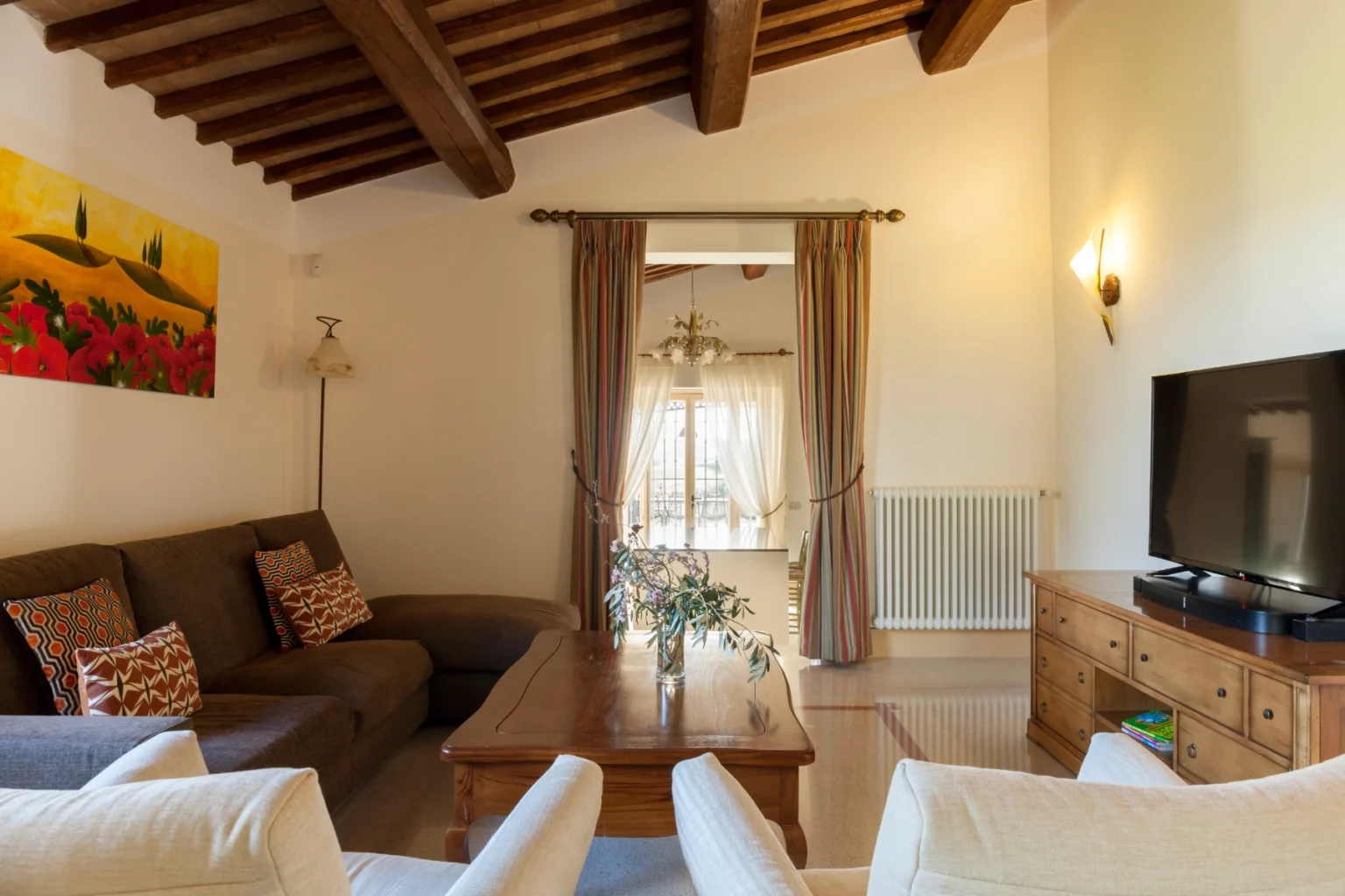 Bisenzio_Elegant_Farmhouse_TV_Room_Comfortable_Sofas.webp | Only on SopranoVillas