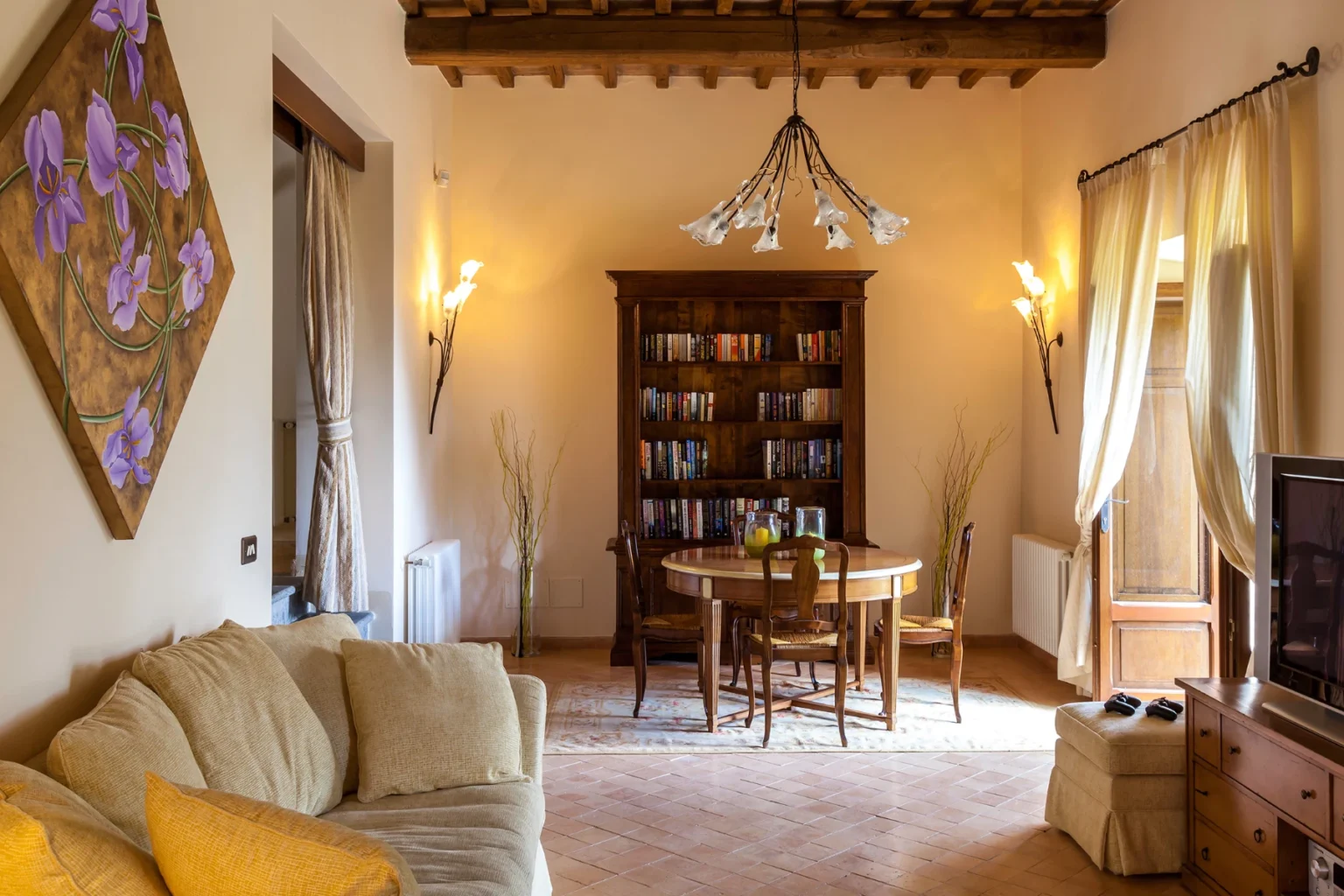 Bisenzio_Historic_Tower_Cozy_Sitting_Room_Bookshelf.webp | Only on SopranoVillas